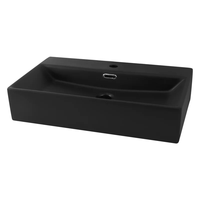 Schwarzes Waschbecken auf einem weißen Tisch, von vorne betrachtet.