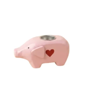 Rosa Kerzenhalter in Schweinchenform mit rotem Herz fĂŒr Mini-Stabkerzen von Madleys.